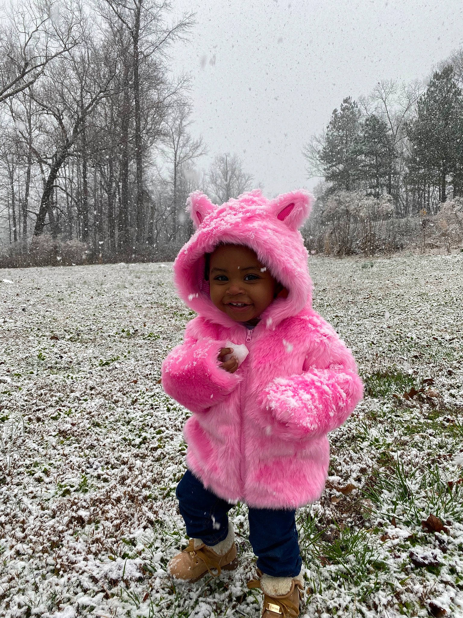 Nola joined the competition — help win amazing prizes! child, flower, freezing, fur, headwear, joy, outerwear, person, pink, plant, play, playing_in_the_snow, snow, toddler, tree, winter