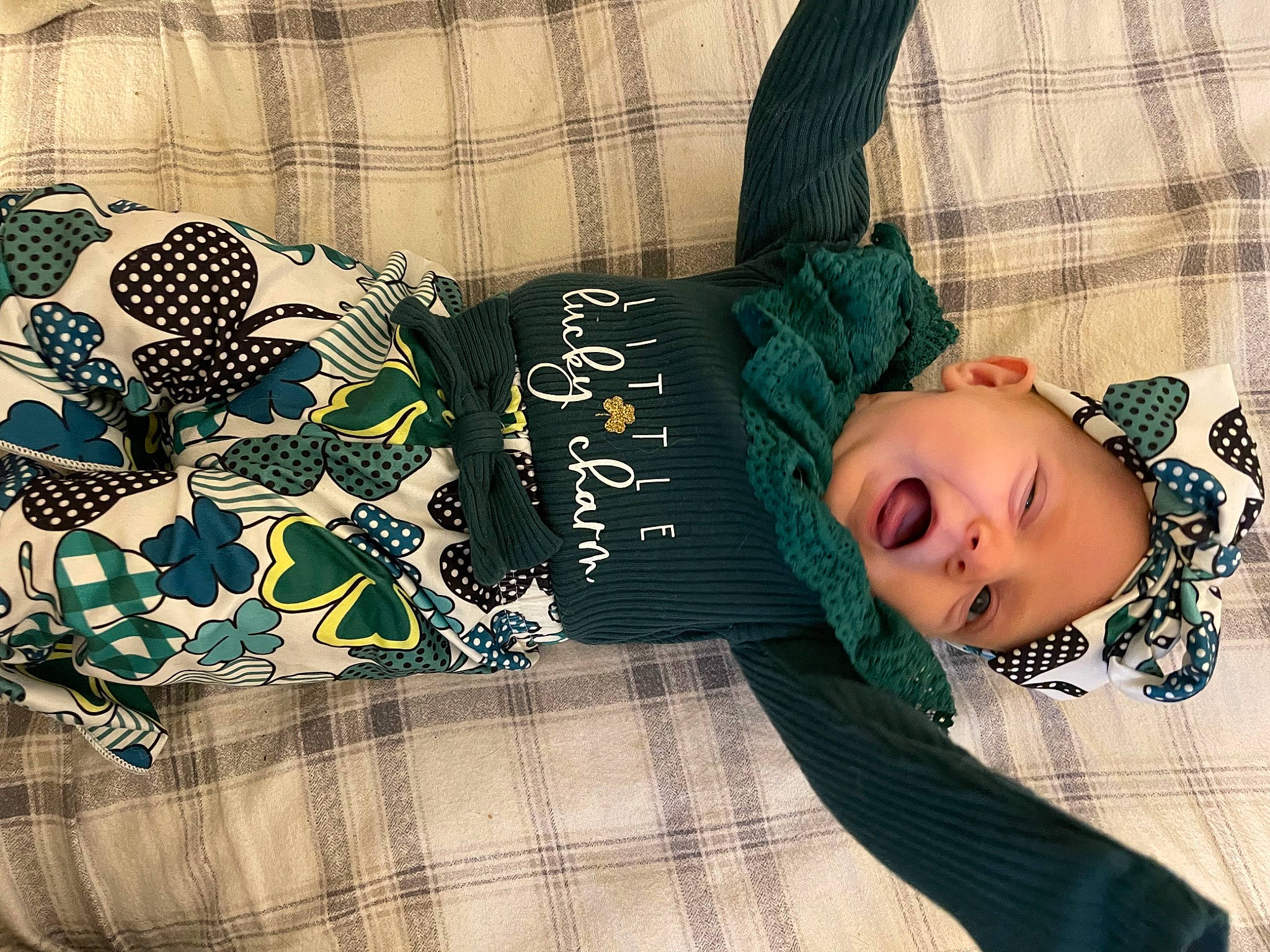 Brynlee joined the competition — help win amazing prizes! black, comfort, cool, denim, fashion_accessory, font, grass, happy, headwear, linens, pattern, person, plaid, room, sitting, sleeve, smile, t_shirt, tartan, textile