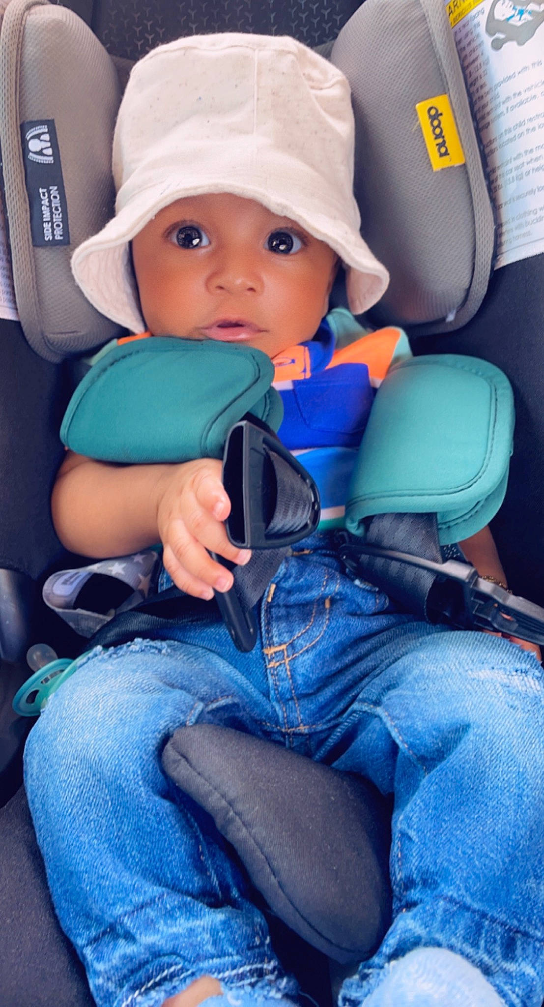 Jamir is registered to the contest to win money with this photo: azure, baby, baby_carriage, baby_in_car_seat, baby_products, baby_toddler_clothing, blue, car_seat, child, clothing, comfort, denim, electric_blue, face, finger, fun, headwear, jeans, person, product