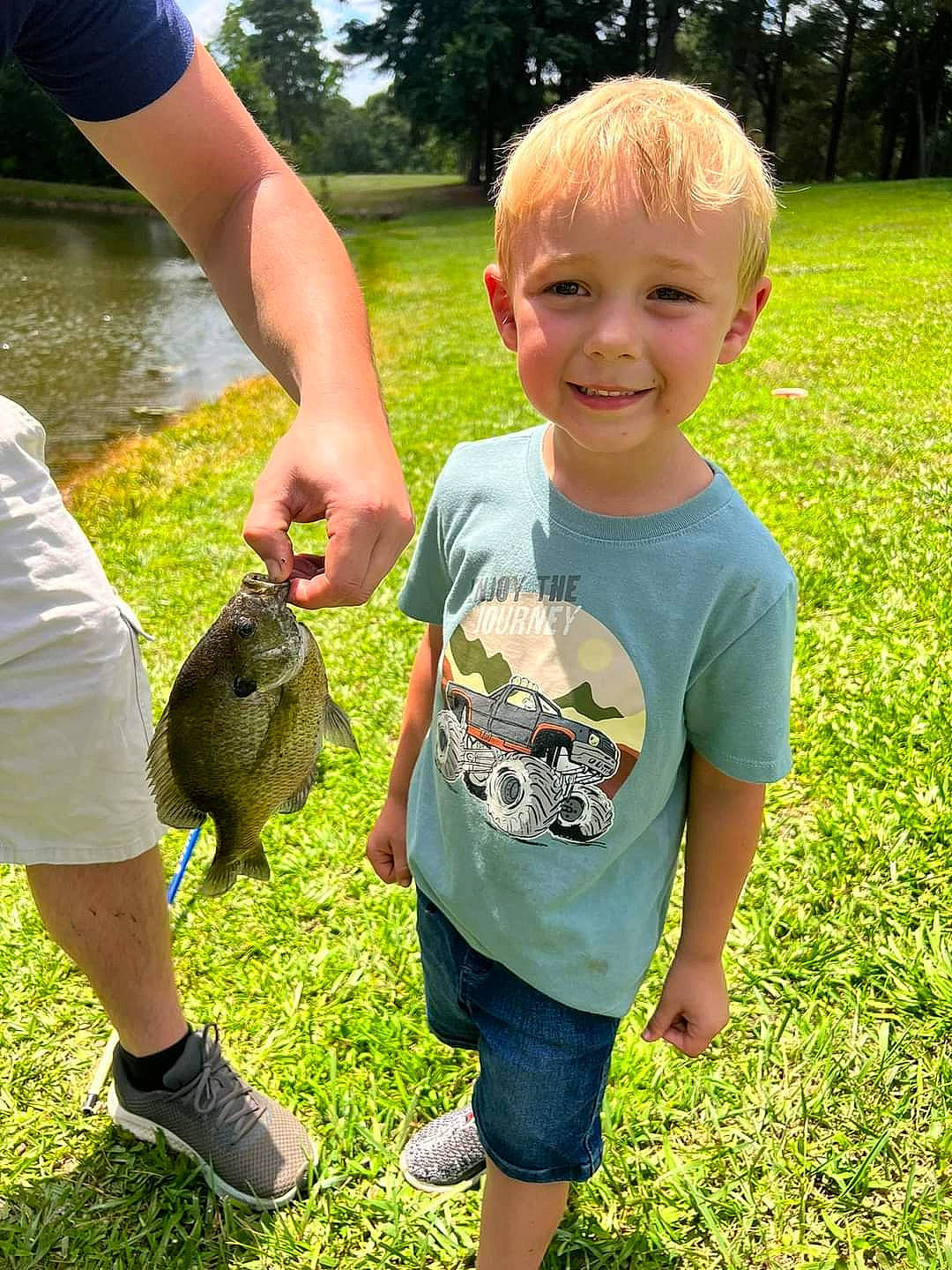 Kholton joined the competition — help win amazing prizes! botany, child, fish, fun, grass, grass_family, grassland, green, groundcover, happy, joy, lawn, leisure, people_in_nature, person, plant, recreation, shorts, smile, t_shirt