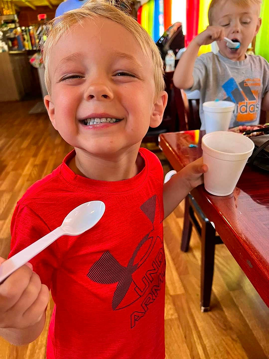 Kholton joined the competition — help win amazing prizes! chair, child, event, eye, finger, food, fun, happy, head, joy, leisure, orange, party_supply, person, play, sleeve, smile, t_shirt, table, tableware