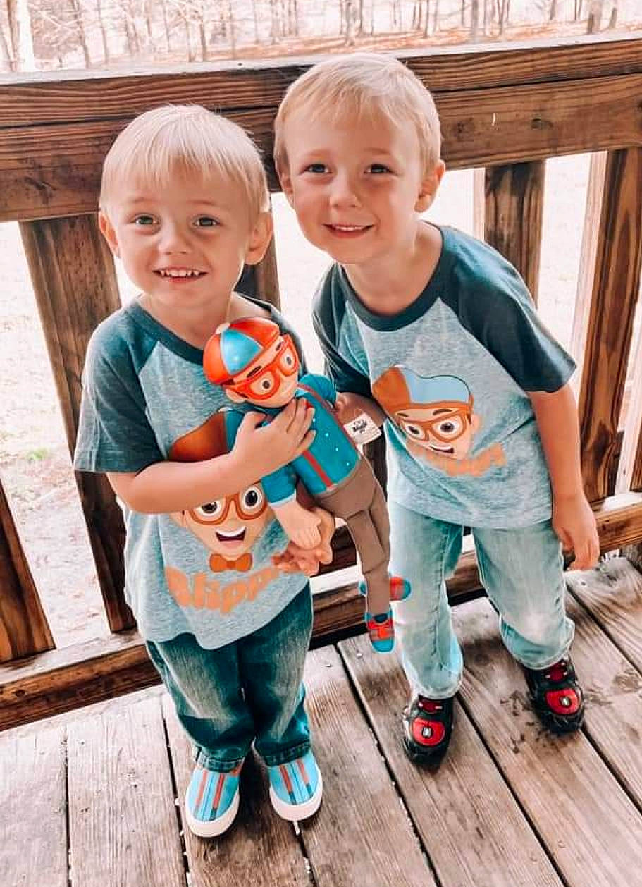 Graeson is registered to the contest to win money with this photo: baby_toddler_clothing, child, deck, event, fun, grass, happy, joy, leg, leisure, people_in_nature, person, play, shoe, sitting, skin, smile, sneakers, standing, t_shirt