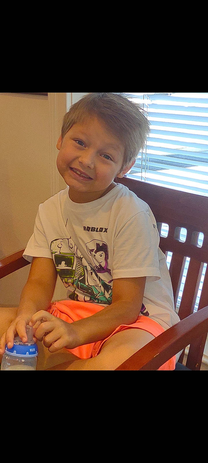 Brad is registered to the contest to win money with this photo: baby, cheek, child, elbow, finger, flooring, fun, hand, happy, joy, leisure, mouth, person, play, sitting, sleeve, smile, t_shirt, thumb, toddler