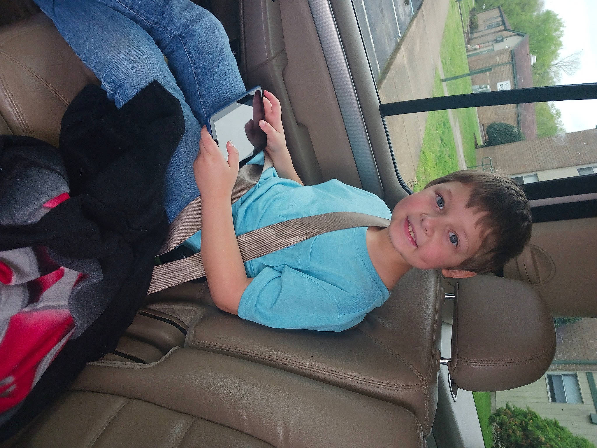 Brad joined the competition — help win amazing prizes! auto_part, automotive_design, automotive_exterior, car_seat, car_seat_cover, comfort, electric_blue, family_car, head_restraint, human_leg, joy, leisure, motor_vehicle, person, plant, seat_belt, smile, thigh, toddler, tree