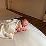 baby, sleeping, blanket, white, soft, infant, cozy, peaceful, skin, hand, head, floor, interior, wooden_floor, lying_down, portrait, newborn, resting, indoor, quiet