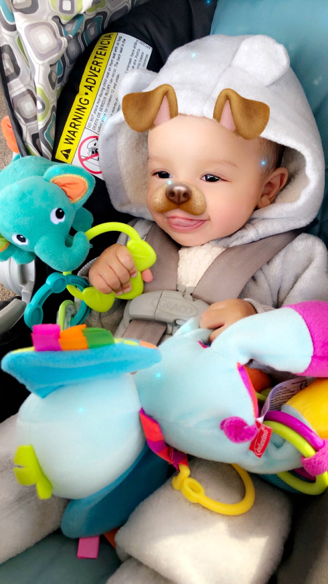 Marcel is registered to the contest to win money with this photo: baby_products, baby_toddler_clothing, baby_toys, blue, cheek, child, happy, head, headwear, mammal, organ, person, pink, plastic, plush, purple, skin, stuffed_toy, textile, toy