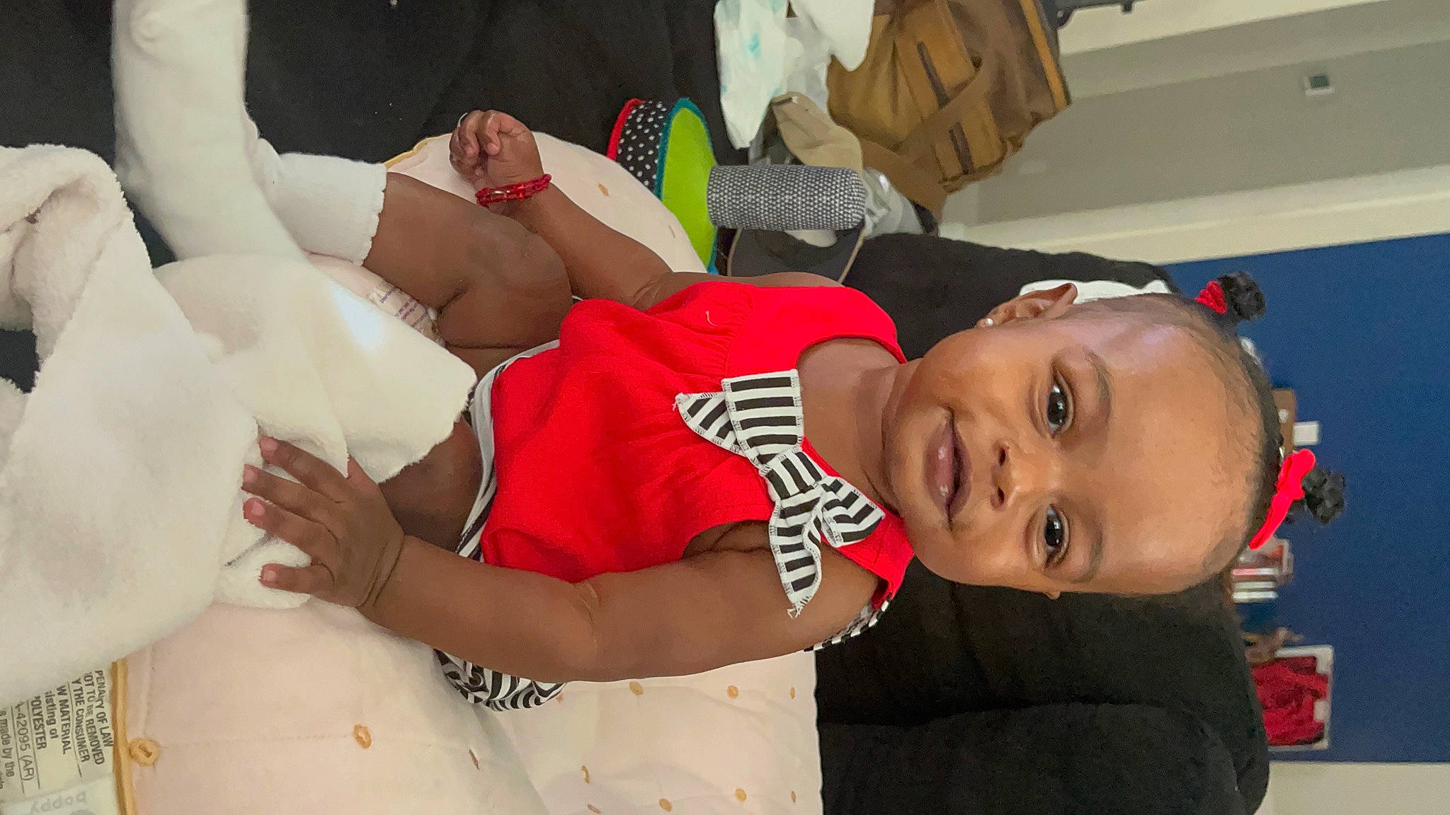 Blair is registered to the contest to win money with this photo: beauty, child, comfort, elbow, fun, gesture, happy, human_body, human_leg, joint, mouth, organ, person, product, skin, smile, textile, thigh, toddler, trunk