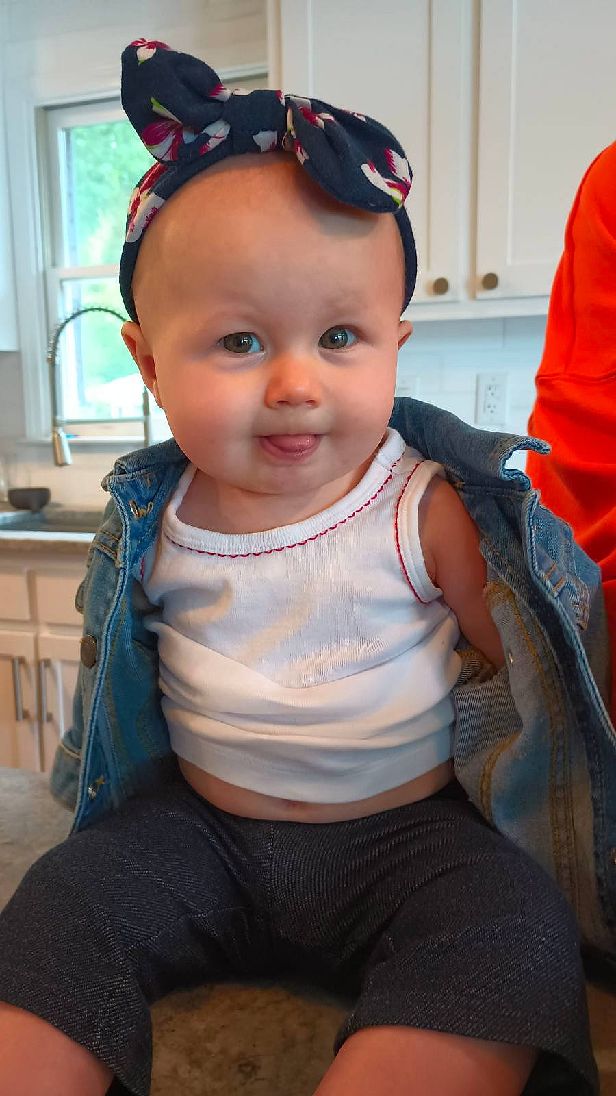 Kyra is registered to the contest to win money with this photo: baby, baby_toddler_clothing, cheek, child, chin, curtain, eye, eyelash, eyewear, fashion_accessory, fun, happy, lip, person, sitting, skin, sleeve, smile, toddler, trunk