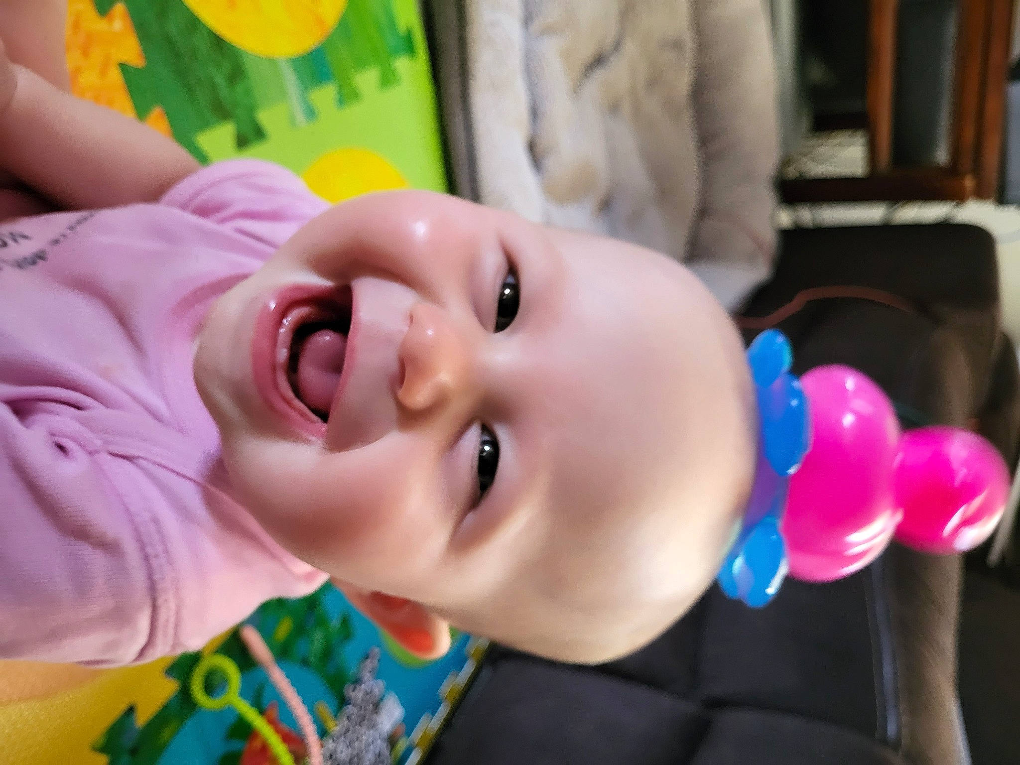 Kyra is registered to the contest to win money with this photo: baby, baby_toddler_clothing, balloon, cheek, child, event, eye, eyelash, fun, happy, head, joy, leisure, lip, nose, person, pink, skin, smile, toddler