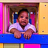 Taytum joined the competition — help win amazing prizes! baby, bright_colors, child, colorful, curious, cute, frame, fun, hands, happy, infant, outdoor, person, play, playground, portrait, smiling, toy, window, young