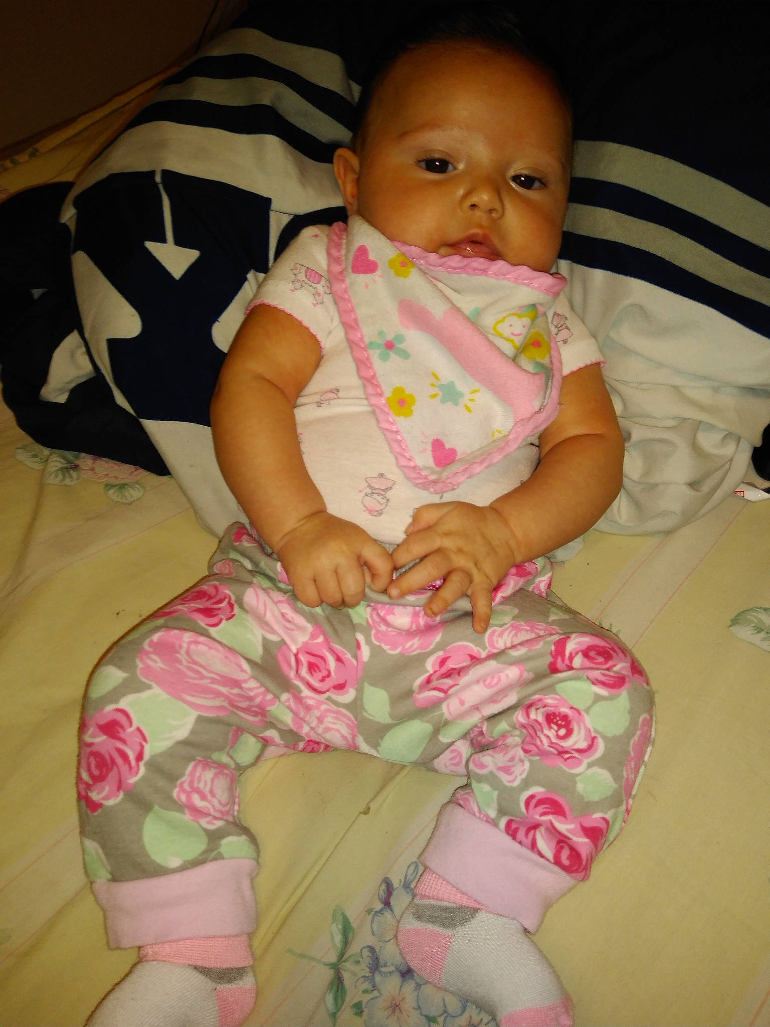 Athena is registered to the contest to win money with this photo: baby, baby_toddler_clothing, cheek, child, person, pink, sitting, skin, textile, toddler