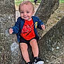 Isaac a rejoint le concours — aidez-le/la à gagner de superbes lots ! child, toddler, tree, outdoor, nature, greenery, smiling, clothing, nike, jacket, shoes, adidas, fence, grass, playful, happy, person, sitting, casual, portrait