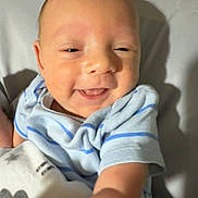 Mallieki joined the competition — help win amazing prizes! baby, smile, infant, onesie, blanket, lion_pattern, hand, face, arm, bed, happy, child, cute, person, newborn, closeup, indoors, skin, expression, lying_down