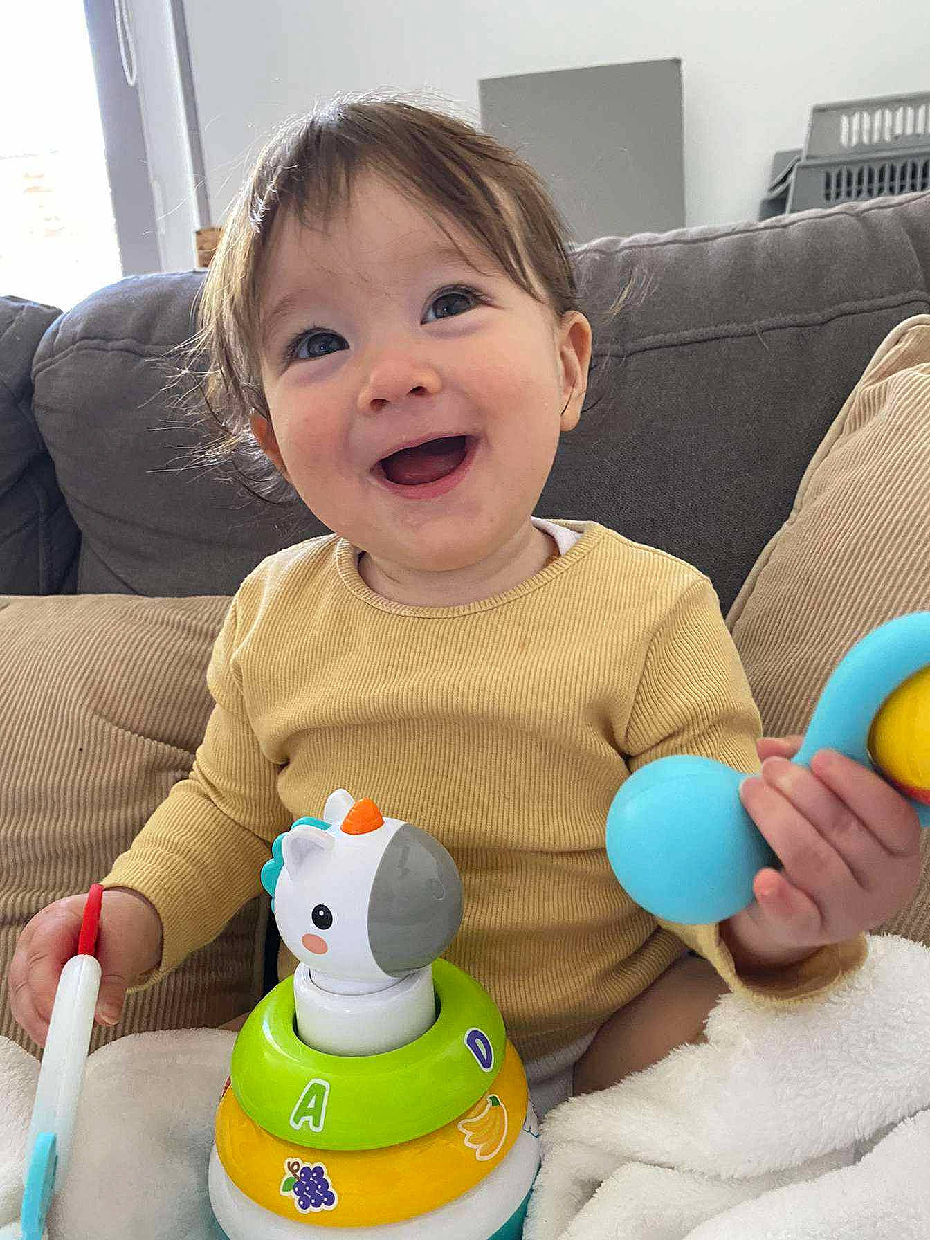Caylie participe au concours pour gagner de l'argent avec cette photo : baby, baby_playing_with_toys, baby_toddler_clothing, cheek, child, comfort, facial_expression, finger, fun, green, happy, joy, organ, people, person, product, skin, smile, stuffed_toy, toddler