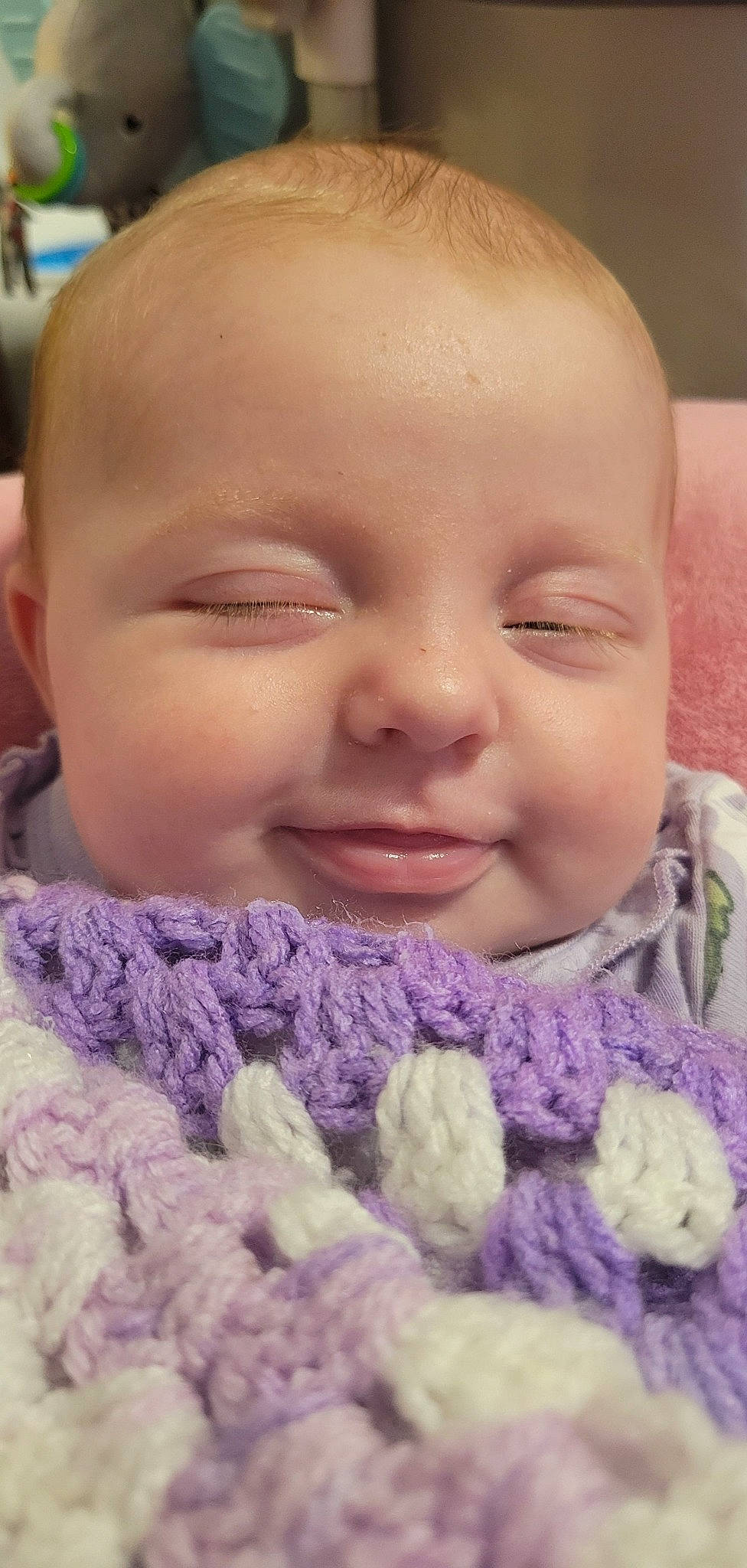 Haizley is registered to the contest to win money with this photo: cheek, eyebrow, eyelash, facial_expression, finger, happy, human, iris, jaw, lip, mouth, nose, organ, person, photograph, pink, purple, skin, smile, toddler