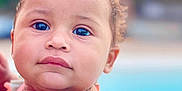 Mya joined the competition — help win amazing prizes! baby, blue_eyes, child, close_up, cute, expression, face, hair, hairband, outdoor, person, ponytail, pool, portrait, skin, summer, swimsuit, toddler, towel, young