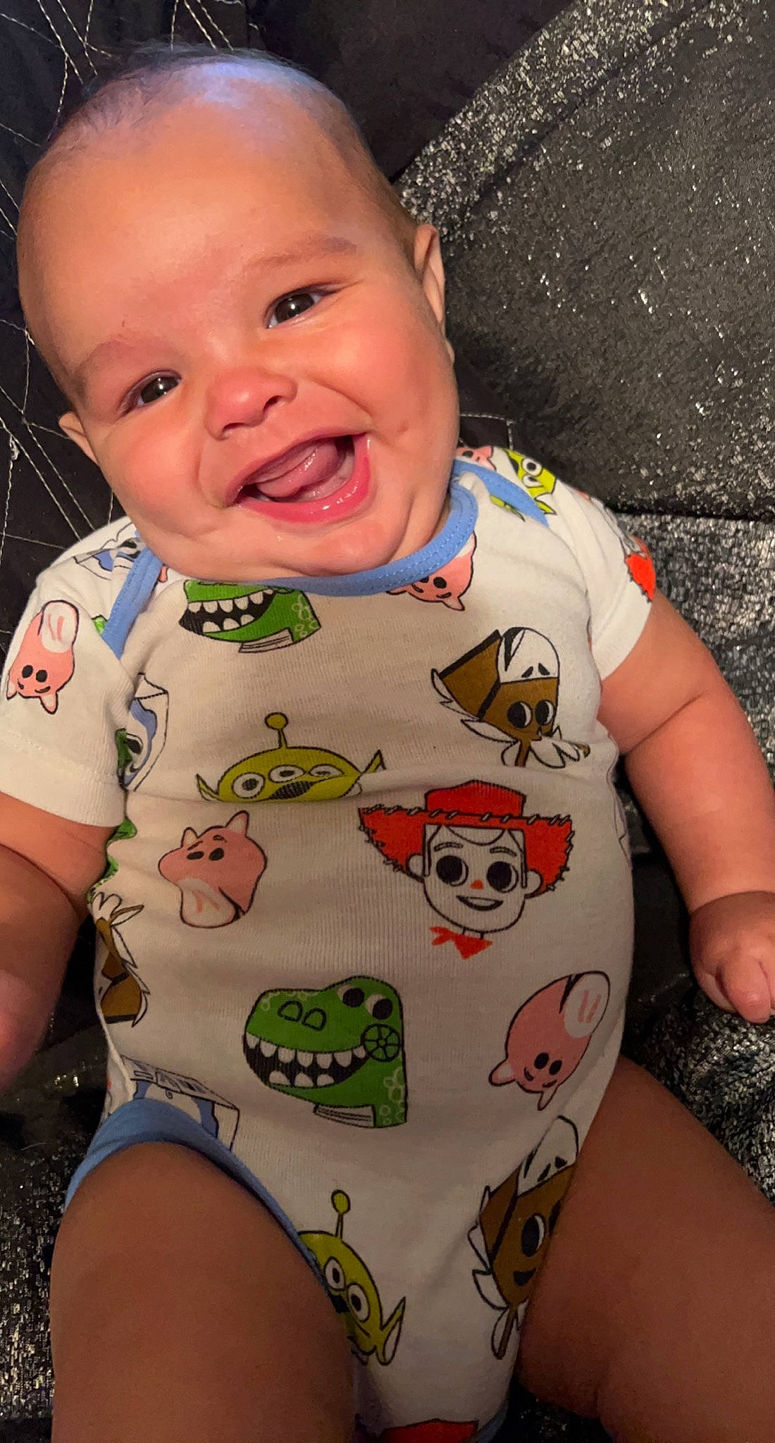 Clayton is registered to the contest to win money with this photo: arm, baby_toddler_clothing, cheek, chin, eye, facial_expression, green, hairstyle, hand, head, human_body, joy, mouth, neck, nose, organ, person, product, skin, smile