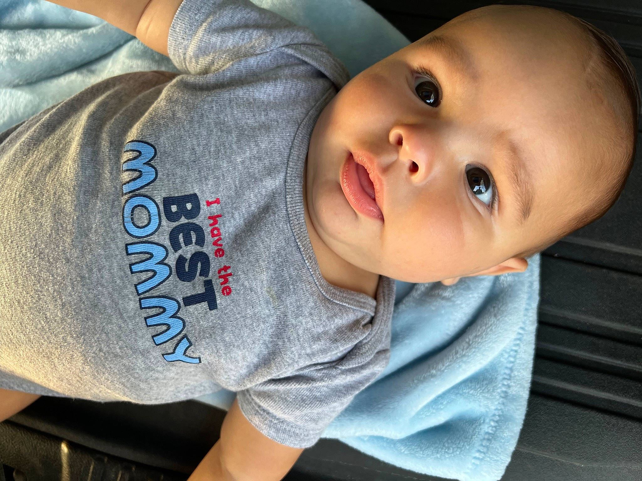 Clayton is registered to the contest to win money with this photo: baby, baby_toddler_clothing, cheek, child, comfort, elbow, electric_blue, eyelash, flash_photography, happy, lip, neck, nose, person, portrait_photography, sitting, skin, sleeve, t_shirt, toddler