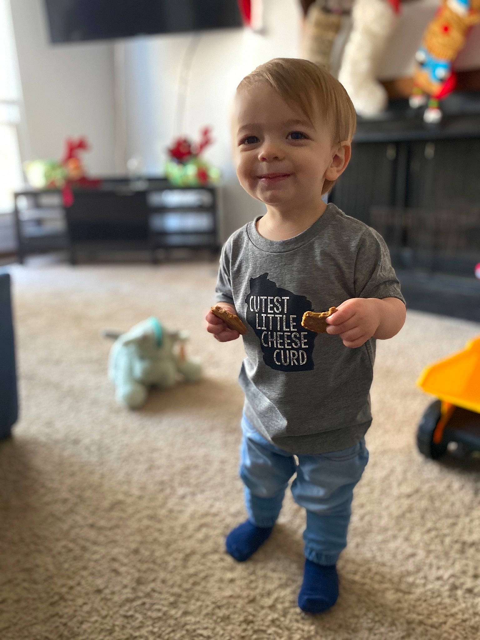 Boston is registered to the contest to win money with this photo: baby, baby_toddler_clothing, child, event, flooring, fun, happy, houseplant, joy, mammal, person, plant, play, sitting, skin, sleeve, smile, t_shirt, tire, toddler
