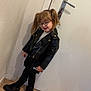 Lya a rejoint le concours — aidez-le/la à gagner de superbes lots ! black_leather_jacket, black_leggings, black_shoes, black_skirt, child, cute, door_handle, fashion, floor, glasses, indoor, person, pigtails, posing, smiling, standing, wall_socket, white_door, wooden_floor, young_child