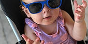 Aurora joined the competition — help win amazing prizes! baby, child, sunglasses, stroller, purple_dress, hands, face, person, outdoor, summer, cute, infant, fashion, expression, seat, casual, blonde_hair, small_person, accessory, portrait