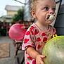 Aurora joined the competition — help win amazing prizes! toddler, child, pacifier, balloon, strawberry_pattern, pink_shirt, outdoor, porch, blurred_background, hand, face, blue_eyes, short_hair, toy, summer_clothing, daylight, person, holding, cute, playful