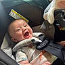 baby, car_seat, child, clothing, comfort, cute, expression, face, happy, head, indoors, infant, joy, person, plush_toy, safety_harness, seat, smile, straps, toy