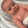 baby, infant, bath, towel, water, skin, face, arm, expression, cute, child, young, human, indoors, closeup, wet, relaxation, bathroom, soft, comfort