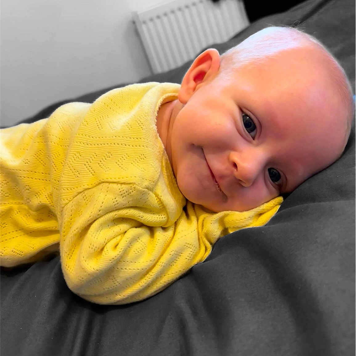 Emie Elise is registered to the contest to win money with this photo: baby, babylaughing, blanket, face, happy, head, person, photography, portrait, smile