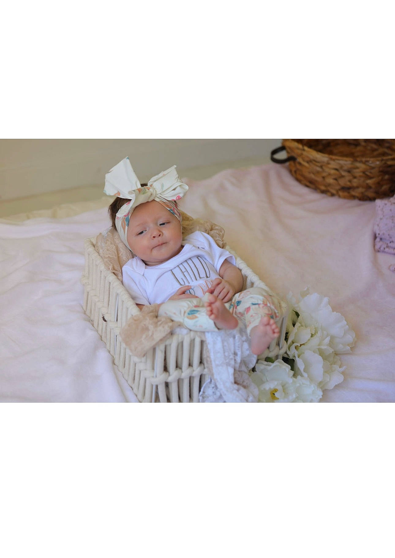 Harper is registered to the contest to win money with this photo: baby, baby_products, baby_sleeping, baby_toddler_clothing, comfort, couch, event, font, happy, hat, headwear, linens, pattern, peach, person, petal, product, room, sleeve, smile