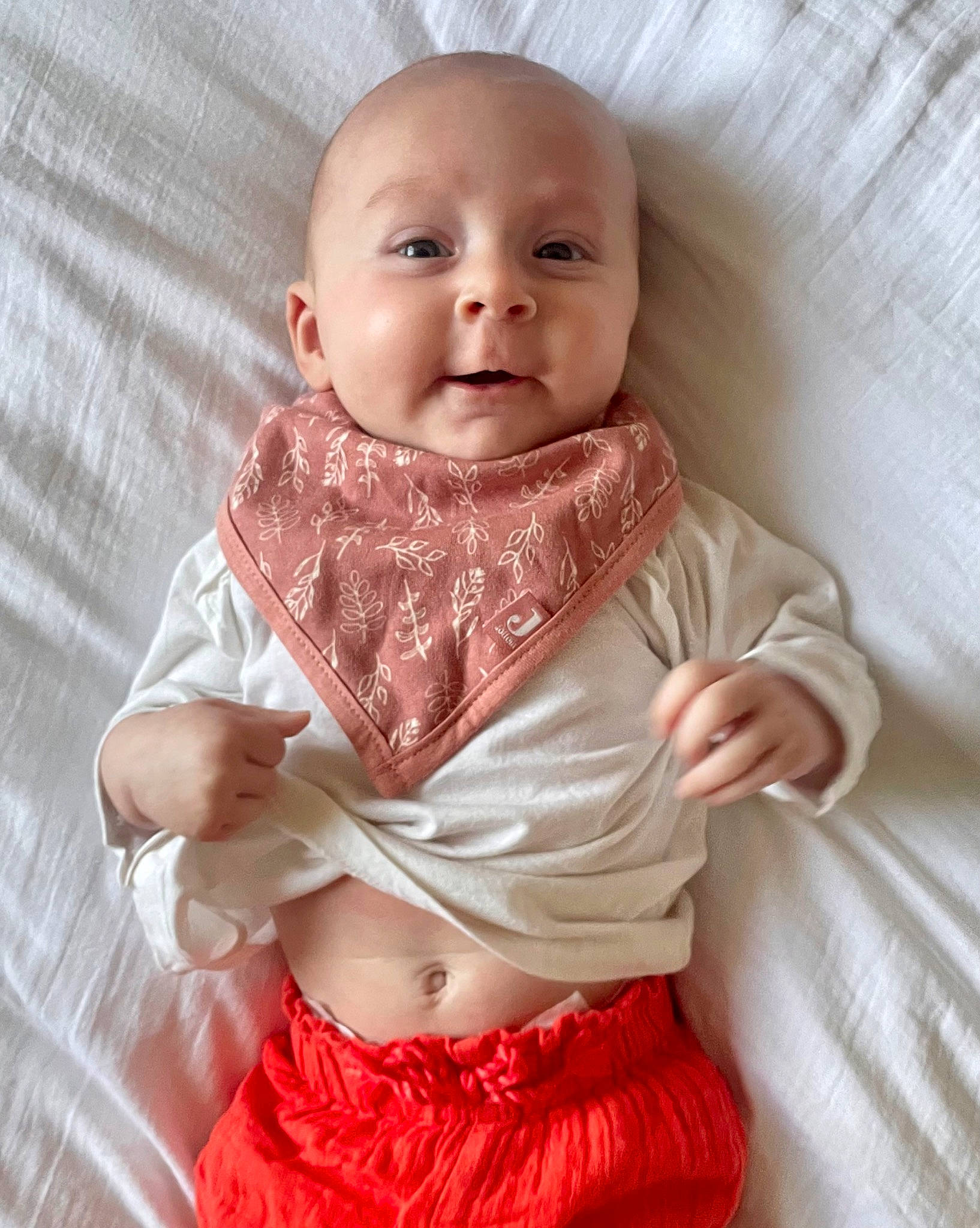 Norah participe au concours pour gagner de l'argent avec cette photo : baby, baby_products, baby_toddler_clothing, collar, comfort, dress, dress_shirt, eye, formal_wear, happy, linens, neck, pattern, person, pink, skin, sleeve, smile, textile, toddler