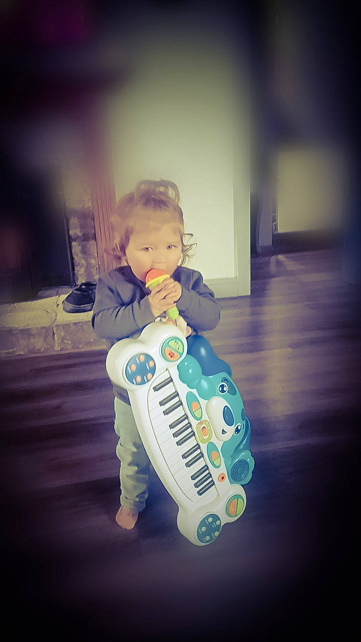 Mia Galloway joined the competition — help win amazing prizes! baby_toys, child, cloud, electric_blue, electronic_instrument, electronic_musical_instrument, entertainment, fictional_character, flash_photography, flooring, font, happy, machine, metal, musical_instrument, person, personal_protective_equipment, robot, sitting, toddler