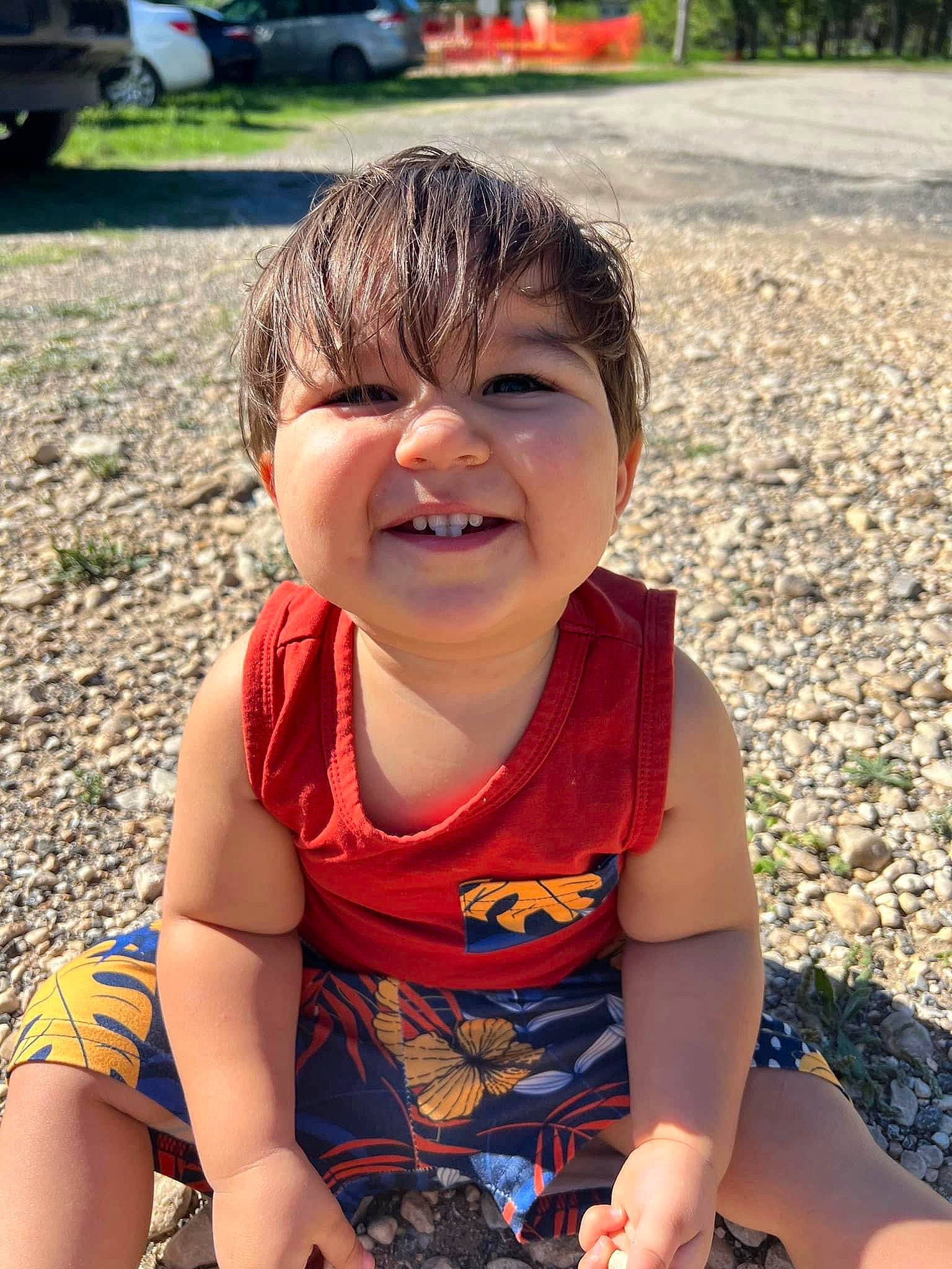 Noah is registered to the contest to win money with this photo: baby_toddler_clothing, beauty, cheek, child, cool, facial_expression, finger, fun, grass, happy, leisure, mouth, person, photograph, plant, recreation, sitting, skin, smile, summer