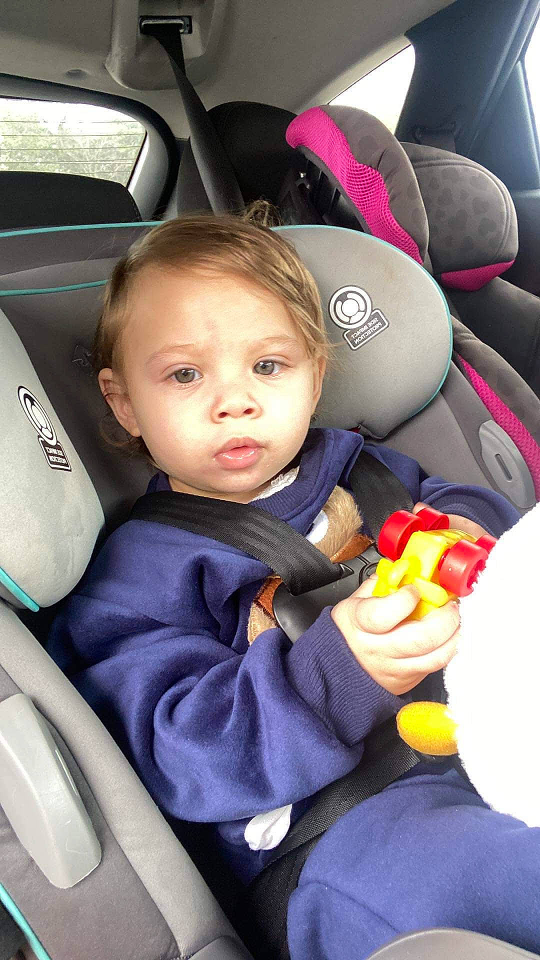 Cyrus is registered to the contest to win money with this photo: automotive_design, automotive_exterior, baby_in_car_seat, car, car_seat, car_seat_cover, child, hand, head_restraint, motor_vehicle, person, personal_luxury_car, plant, product, seat_belt, steering_part, steering_wheel, toddler, vehicle, vehicle_door