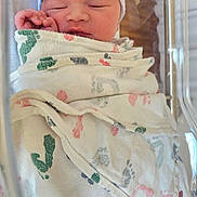 Odin joined the competition — help win amazing prizes! newborn, baby, sleeping, blanket, hospital, bassinet, cap, infant, wrapped, peaceful, face, skin, hand, closed_eyes, soft, footprint_pattern, bed, hospital_bed, child, portrait