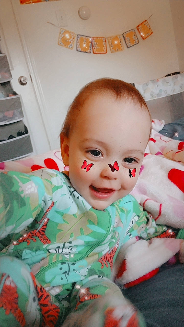 Atreus joined the competition — help win amazing prizes! baby, baby_products, baby_toddler_clothing, carmine, cheek, child, eyelash, fictional_character, fun, happy, head, linens, mouth, nose, pattern, person, portrait_photography, room, sitting, smile