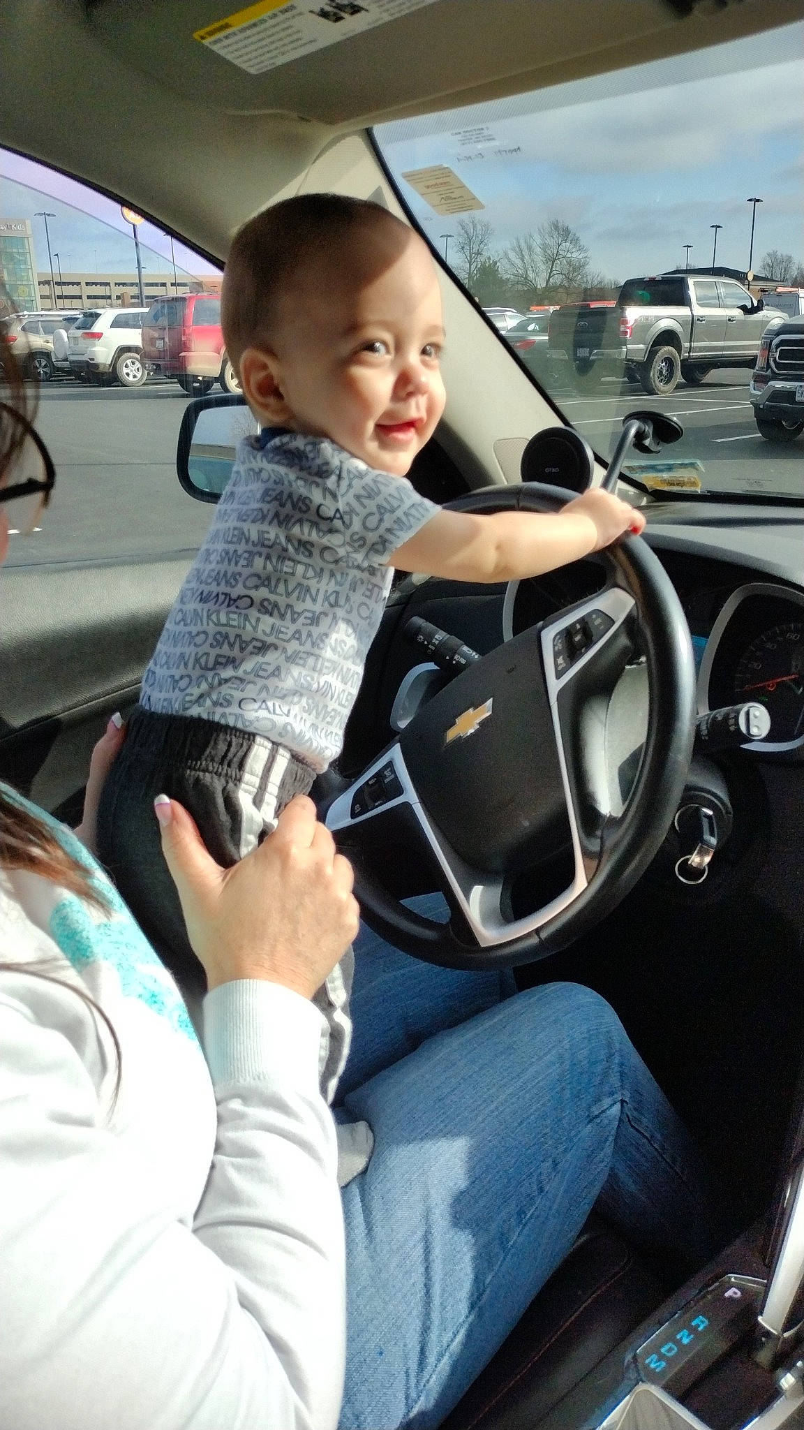 Atreus is registered to the contest to win money with this photo: auto_part, automotive_design, automotive_exterior, automotive_tire, automotive_wheel_system, automotive_window_part, car, family_car, mid_size_car, motor_vehicle, person, personal_luxury_car, sky, smile, steering_part, steering_wheel, toddler, vehicle, vehicle_door, wheel