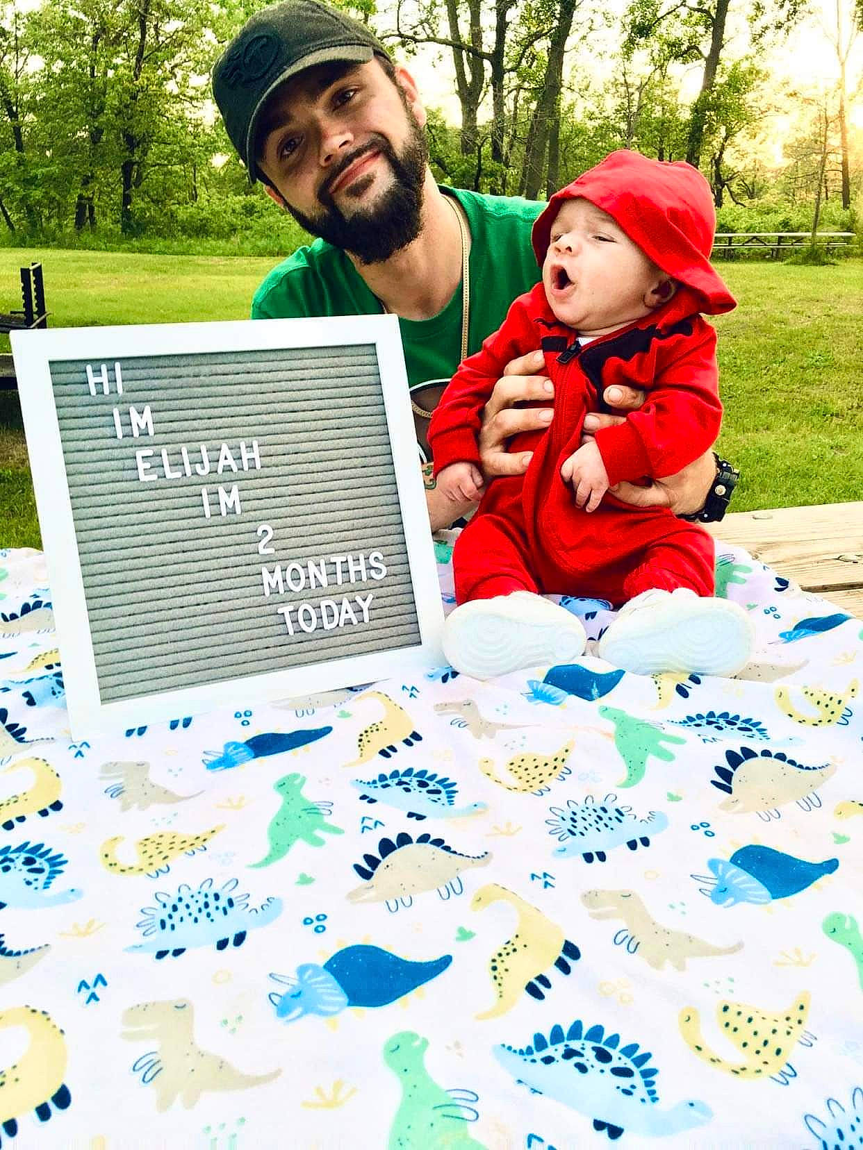 Elijah M Jackson is registered to the contest to win money with this photo: art, beard, cap, font, fun, grass, green, happy, hat, headwear, jacket, joy, leisure, nature, people, people_in_nature, person, picture_frame, product, recreation