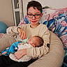 baby, blanket, blue_toy, bottle, casual_clothing, child, cuddle, family, feeding, glasses, home, indoor, newborn, nursery, pillow, portrait, sibling, smile, sofa, stuffed_animal