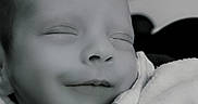Eden participe au concours pour gagner de l'argent avec cette photo : baby, blanket, cheek, close_up, cozy, cuddly, eyelids, face, infant, monochrome, nap, newborn, nose, pacifier_chain, peaceful, portrait, skin, sleeping, smile, soft_lighting