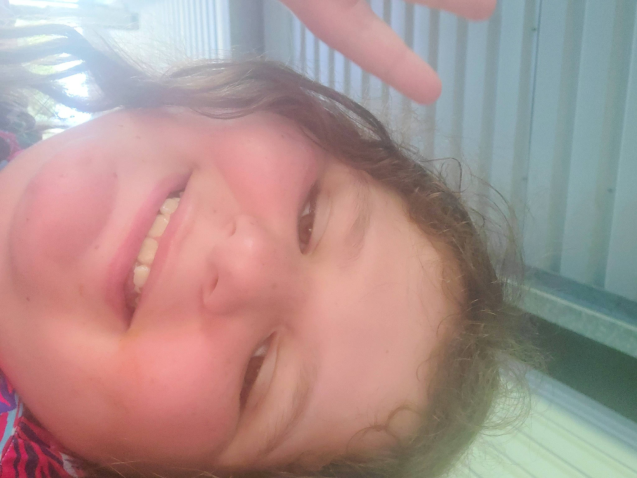 Emma is registered to the contest to win money with this photo: black_hair, cheek, chest, ear, eyelash, forehead, gesture, happy, human_body, iris, jaw, joy, lip, mouth, neck, nose, person, skin, smile, throat