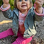 Julia a rejoint le concours — aidez-le/la à gagner de superbes lots ! baby, blue_eyes, child, clothing, curious, cute, daylight, expression, face, happy, jacket, nature, outdoor, pebbles, person, pink_pants, portrait, sitting, smiling, toddler