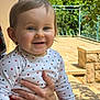 Julia participe au concours pour gagner de l'argent avec cette photo : baby, child, smiling, polka_dot_shirt, hand, ring, outdoor, daylight, garden, fence, happy, portrait, person, red_pants, face, head, skin, eyes, long_sleeve, sitting