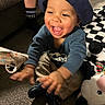 Heath joined the competition — help win amazing prizes! toddler, child, smiling, indoor, hat, blue_clothing, plush_toy, panda, carpet, happy, baby, sitting, footwear, person, toy, playful, cute, young_child, home, carpeted_floor