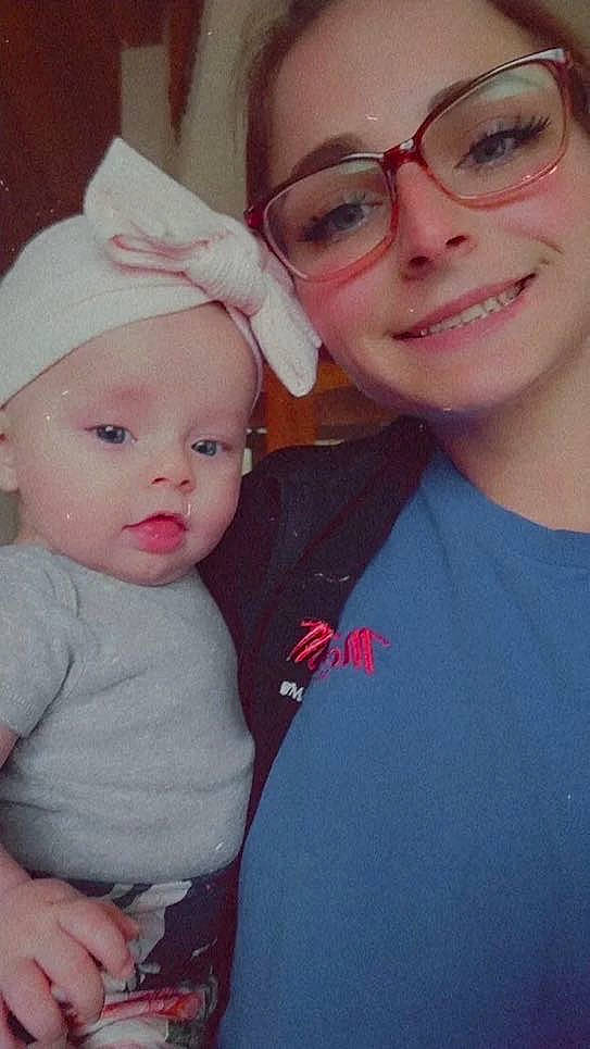 Betty is registered to the contest to win money with this photo: baby_toddler_clothing, cap, cheek, chin, clothing, ear, eye, eyebrow, facial_expression, forehead, gesture, glasses, happy, iris, joy, lip, mouth, nose, person, skin