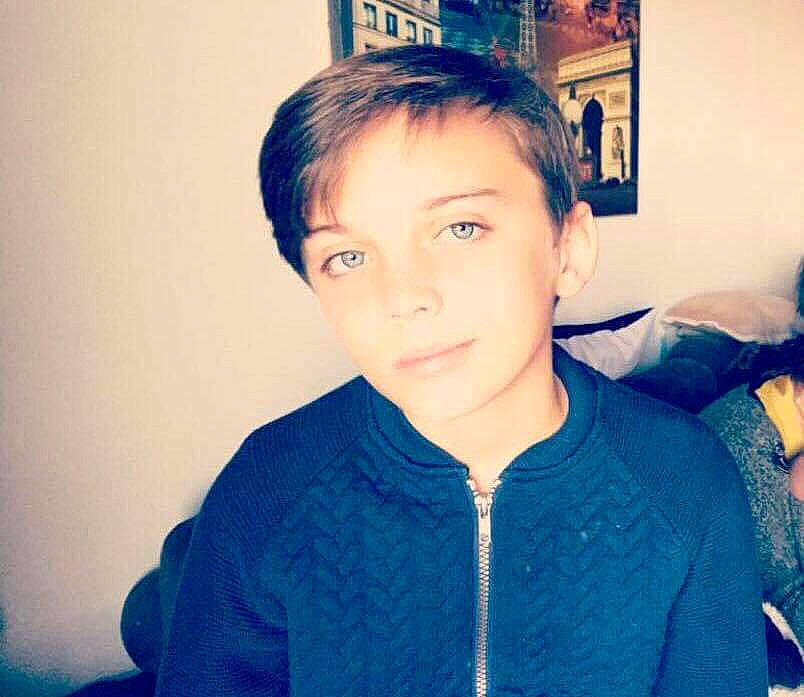 Marc Antoine participe au concours pour gagner de l'argent avec cette photo : black_hair, blue, boy, cheek, child, chin, cool, day, ear, eye, eyebrow, forehead, girl, hair, hairstyle, human_hair_color, neck, outerwear, person, smile