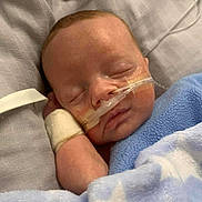 Theo joined the competition — help win amazing prizes! baby, sleeping, blanket, blue, stars, hospital, nasal_tube, bandage, pacifier, bed, infant, peaceful, child, medical, resting, soft, cute, healthcare, face, person