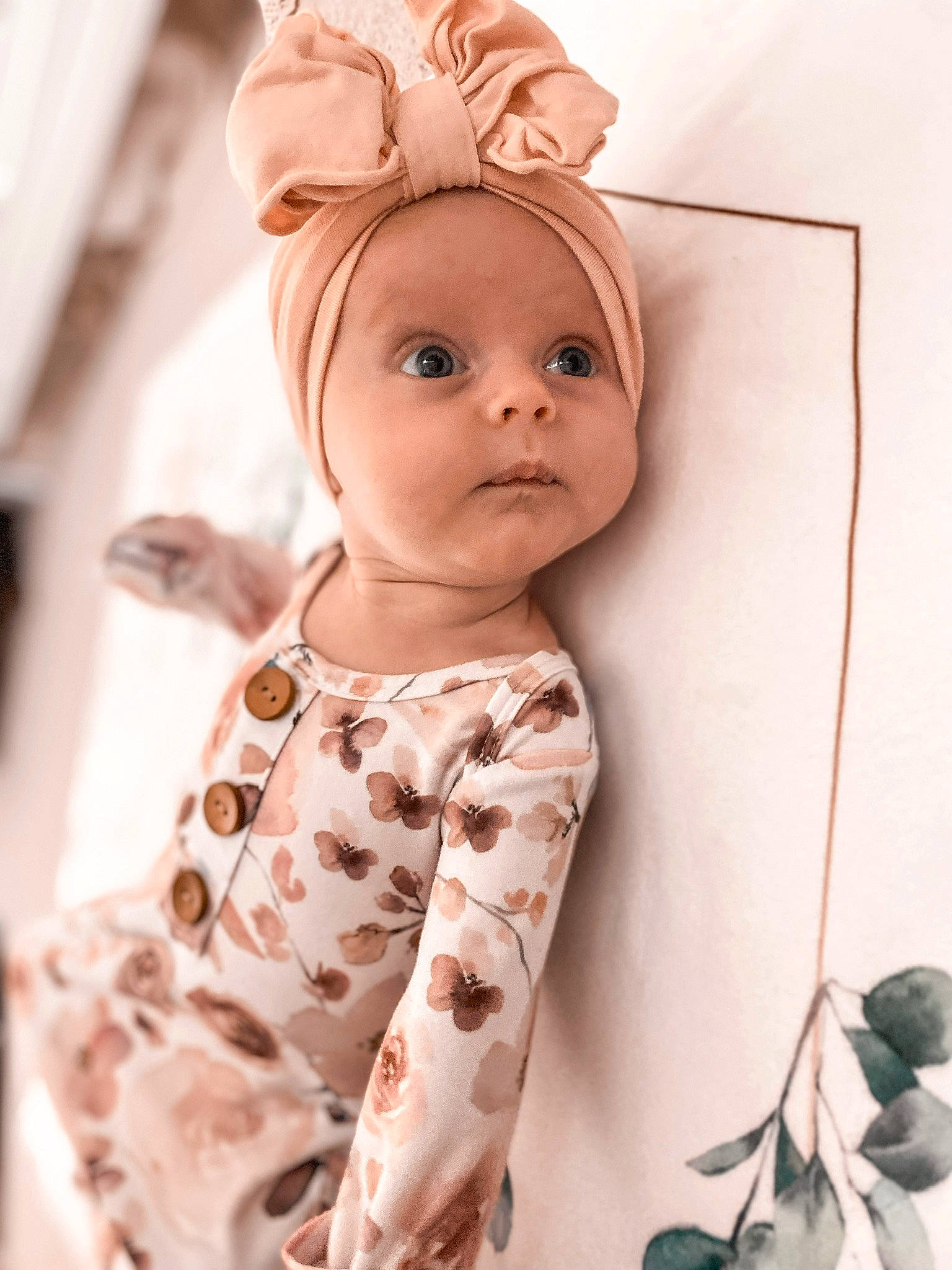 Olivia Rose is registered to the contest to win money with this photo: arm, baby, baby_toddler_clothing, cap, cheek, collar, costume_hat, dress_shirt, eye, eyelash, face, happy, head, human_body, lip, outerwear, person, skin, sleeve, textile