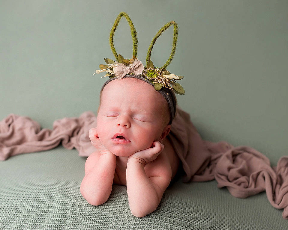 Olivia Rose joined the competition — help win amazing prizes! baby, baby_toddler_clothing, beanie, child, comfort, crown, fashion_accessory, foot, hair_accessory, headband, headgear, headpiece, jewellery, linens, peach, person, pink, sitting, skin, toddler