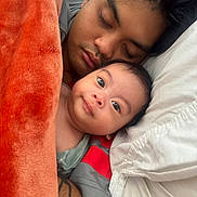 Jayce is registered to the contest to win money with this photo: adult, baby, bed, blanket, closeup, cozy, cuddle, face, family, human, indoors, laying_down, love, parent, rest, sleep, sleeping, together, warm, young_child